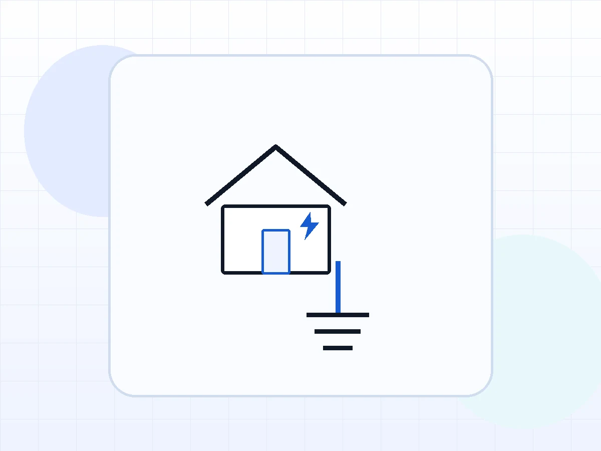 Ilustración de una vivienda y el símbolo de puesta a tierra